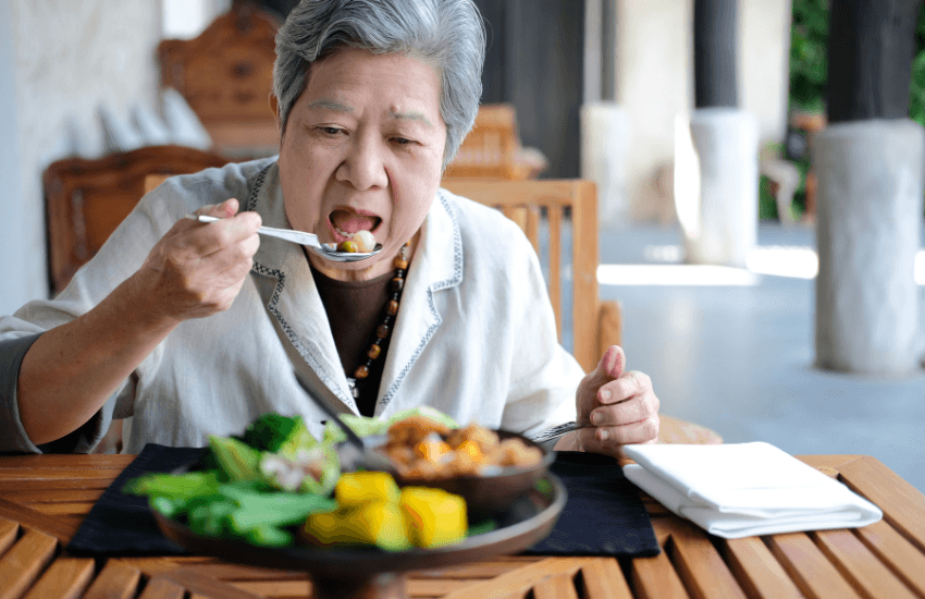 Older woman eating a healthy, colourful, well-balanced meal